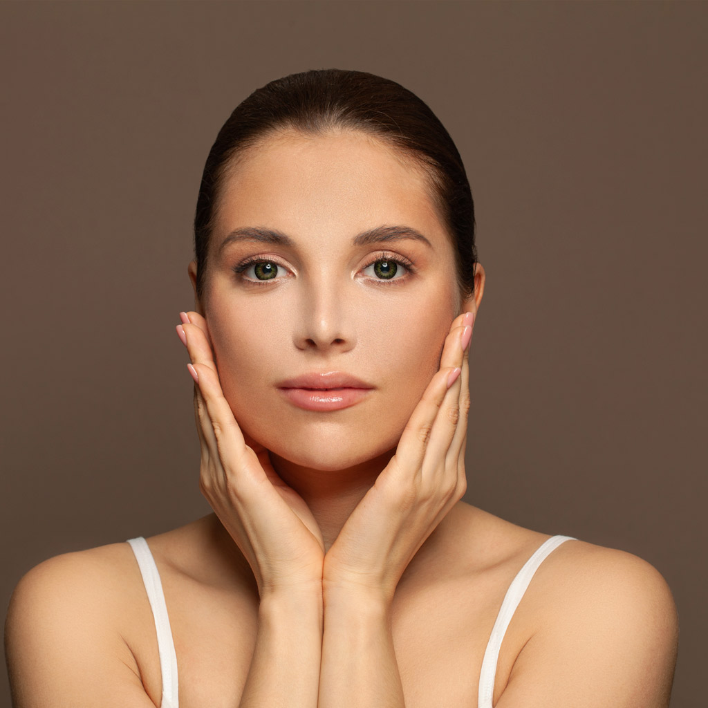 Facials and Microdermabrasion woman spa model on brown background